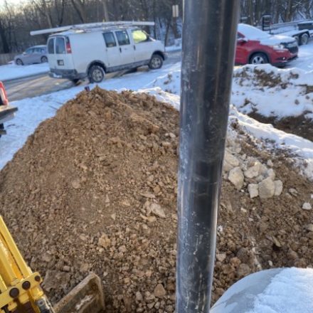 Excavated spoil pile at a winter job