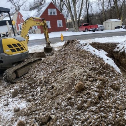 Excavator working a roadside dig