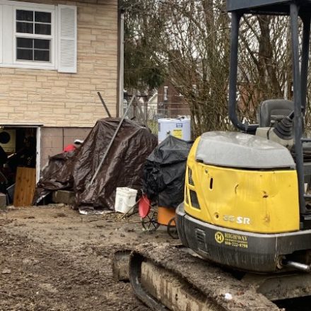 Mini excavator at a residential job site