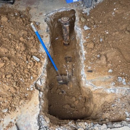Open pit around a service line connection